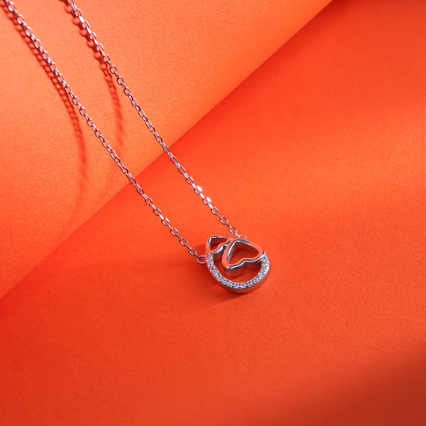 Twin Hearts Embrace Chain Pendant